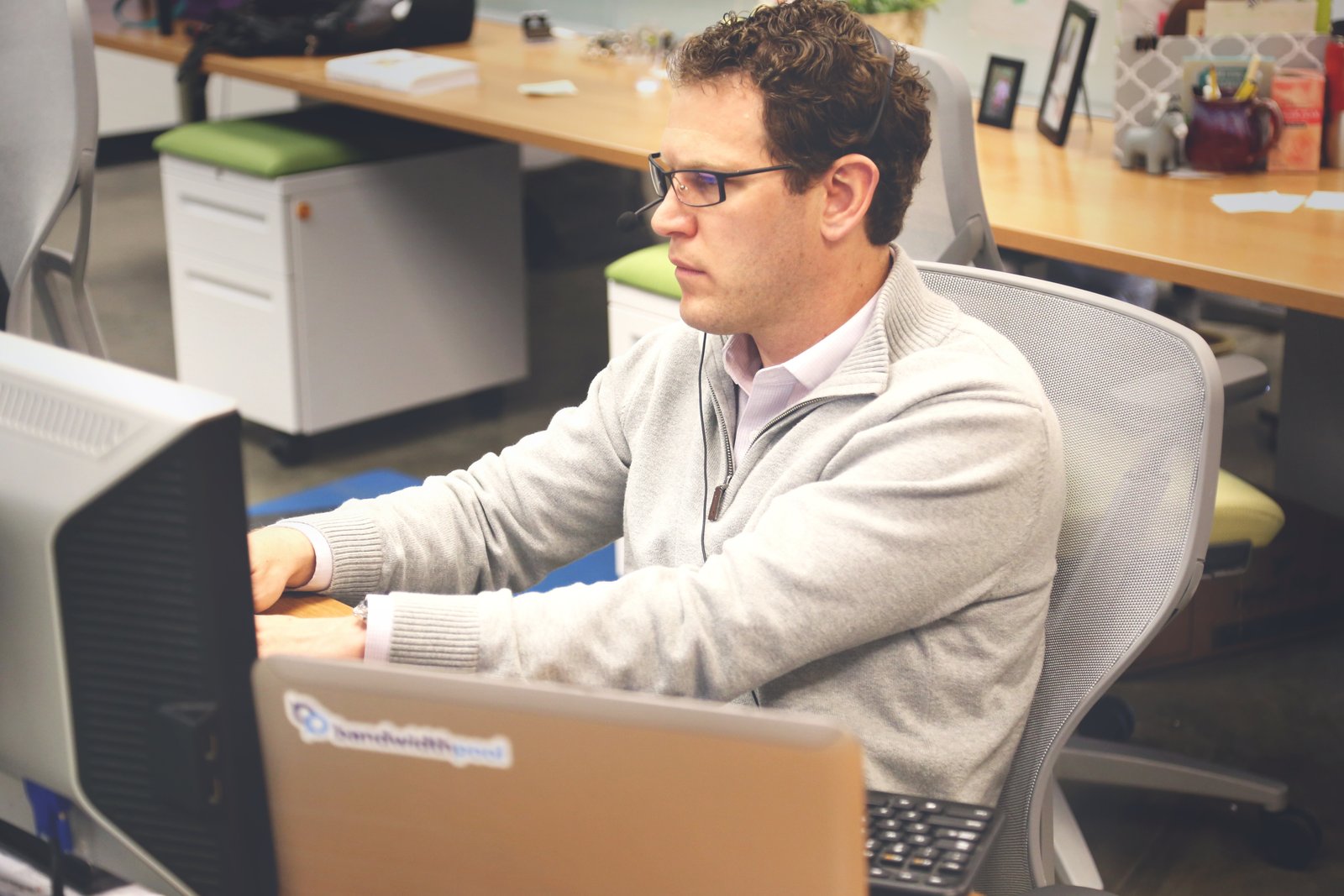 Modern international coworking workspace representing OUAFAE GROUP's remote-first way of working